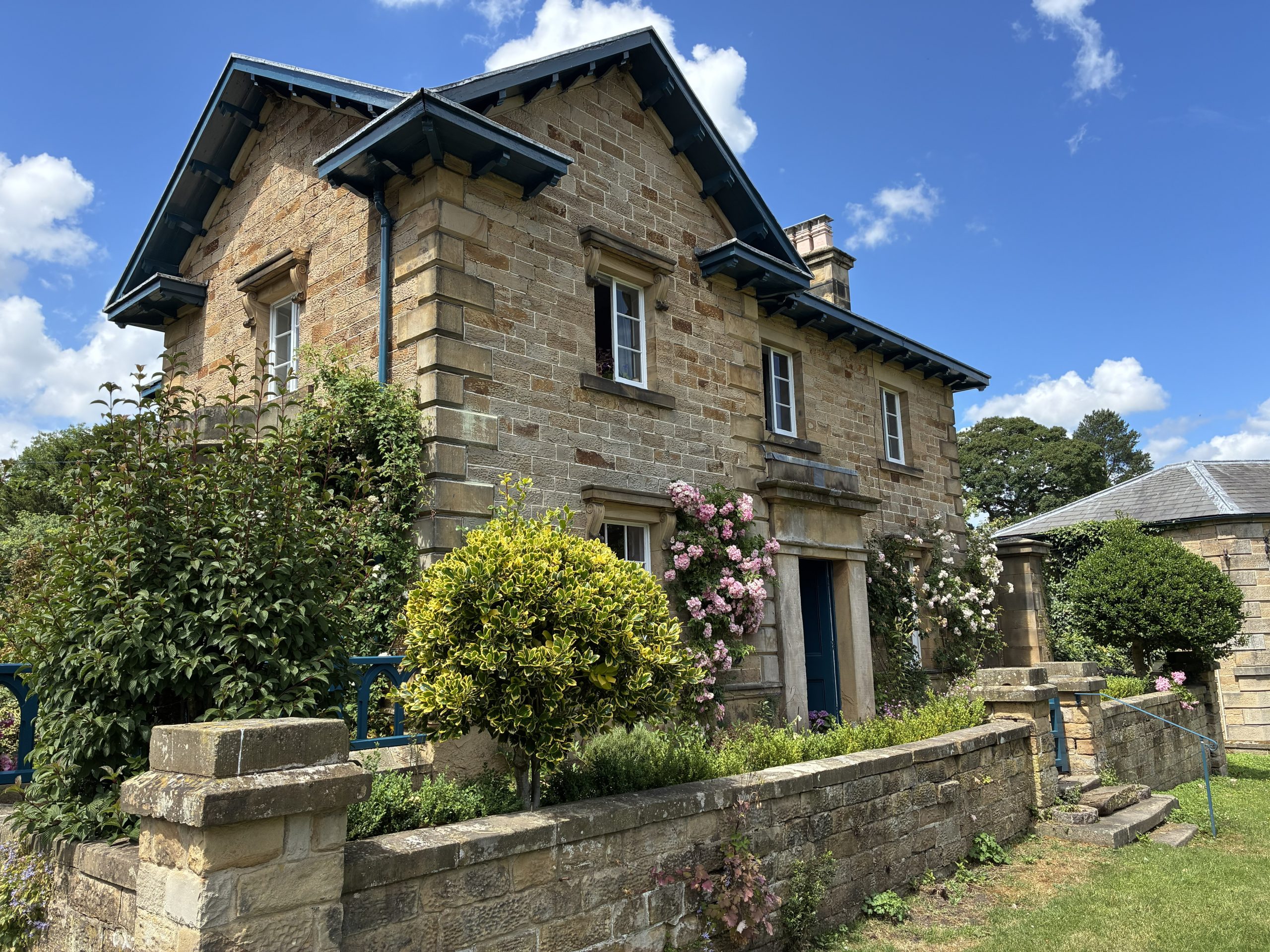 The Chatsworth Area featuring a traditional stone cottage in the historic village of Edensor, Peak District.