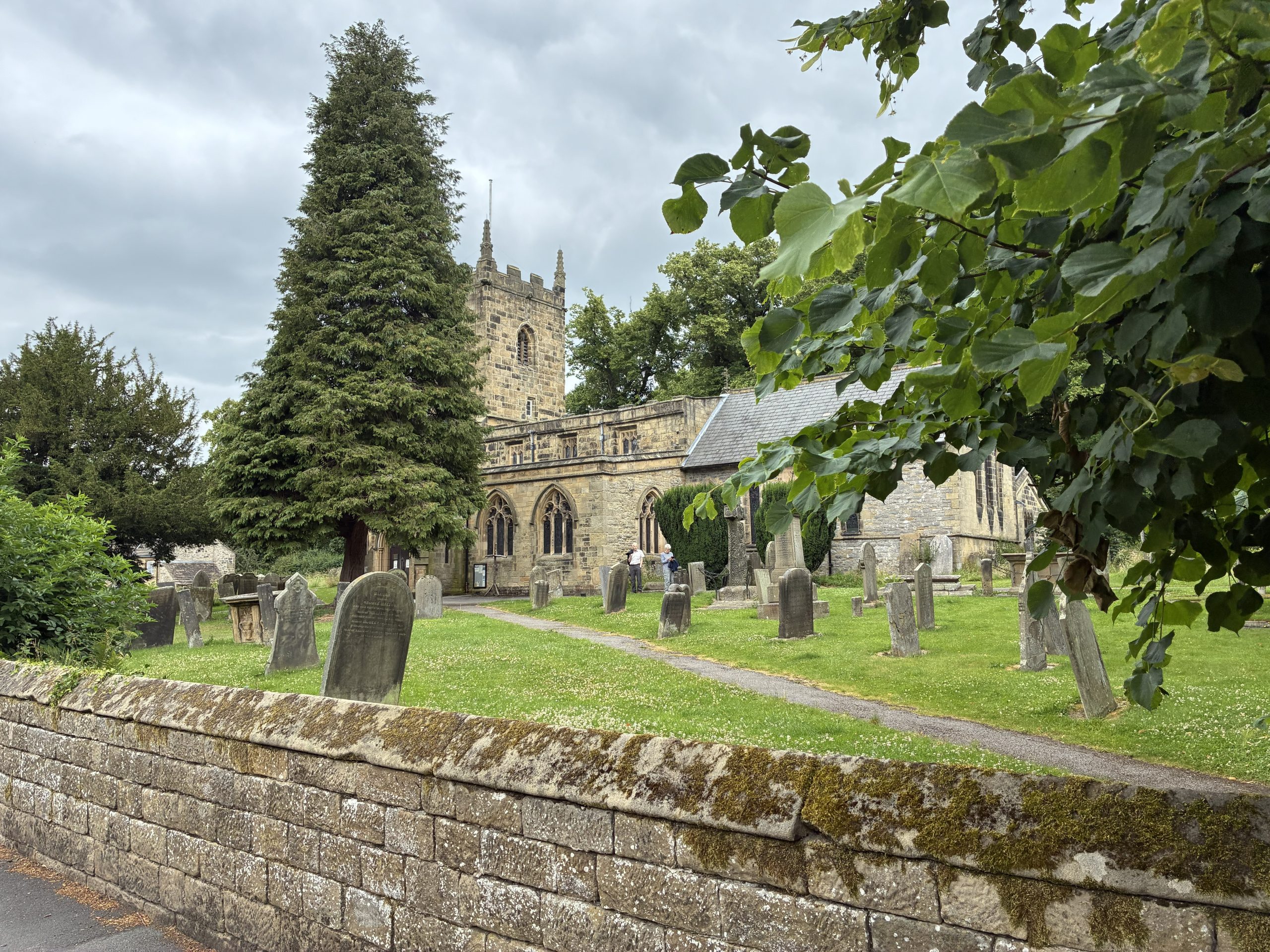 Your Guide to Eyam – St Lawrence's Church in the heart of the historic Peak District village.